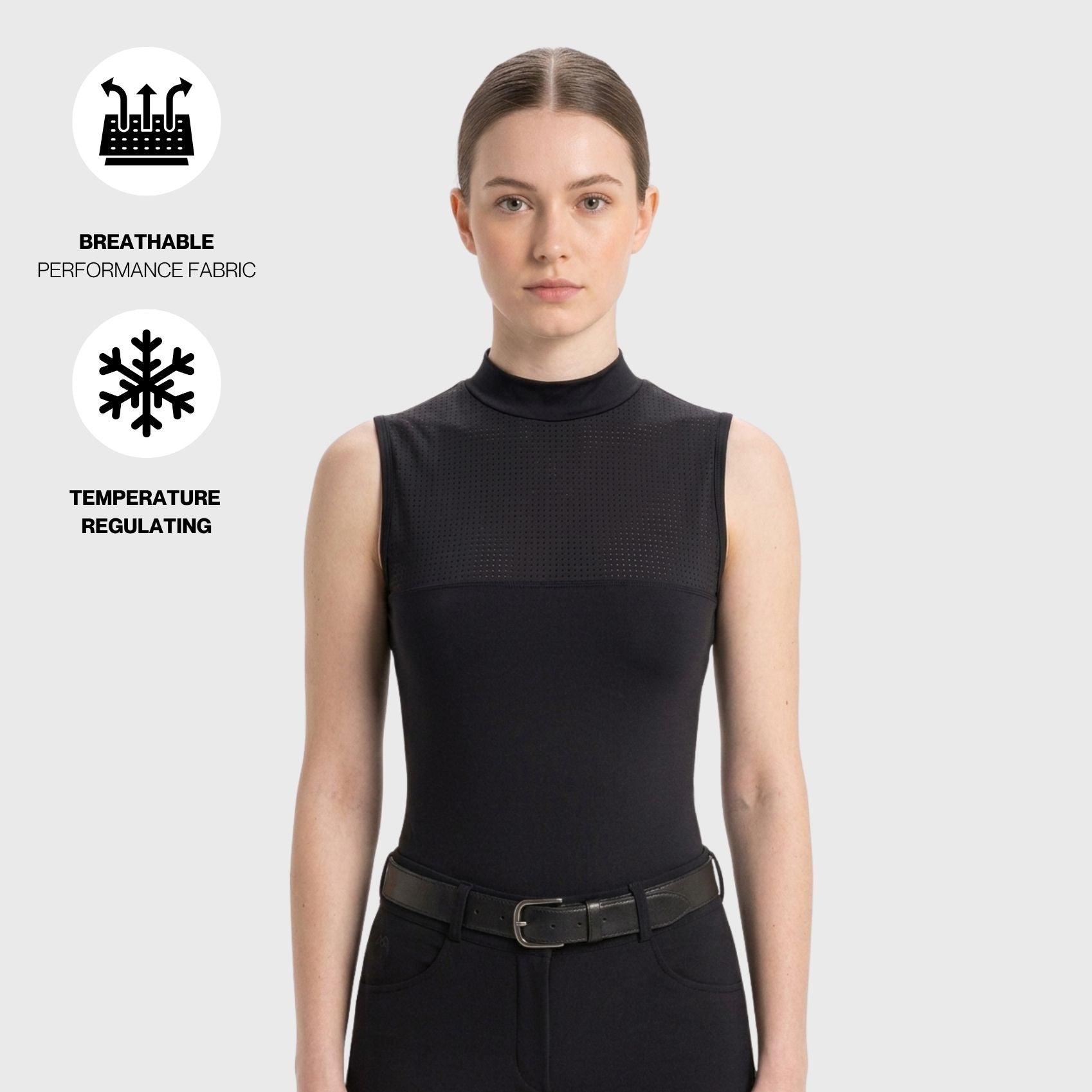 A woman wearing a black sleeveless mock-neck performance top with a textured mesh upper section, shown against a light gray background with feature icons for breathable performance fabric and temperature regulating properties.